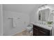 Neat bathroom with granite vanity and a sleek mirror adding a modern touch at 5816 Sand Pebble Pl, Raleigh, NC 27613