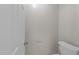 Clean half-bathroom with modern toilet and neutral wall color at 5816 Sand Pebble Pl, Raleigh, NC 27613