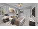 Modern bedroom with stylish decor, large windows, and comfortable furnishings at 5816 Sand Pebble Pl, Raleigh, NC 27613