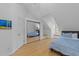 Cozy bedroom with a mirrored closet and ample natural light from a window at 5816 Sand Pebble Pl, Raleigh, NC 27613