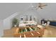 Bonus room with a wet bar, foosball table, and comfortable seating area at 5816 Sand Pebble Pl, Raleigh, NC 27613