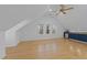 Open bonus room with hardwood floors, recessed lighting, wet bar, and plenty of natural light at 5816 Sand Pebble Pl, Raleigh, NC 27613