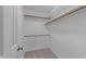 Spacious walk-in closet with multiple hanging rods and shelving for storage at 5816 Sand Pebble Pl, Raleigh, NC 27613