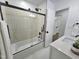 Modern bathroom featuring a tiled shower and tub with sleek black fixtures at 5920 Holly Dr, Raleigh, NC 27616