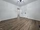 Bedroom with vinyl floors, ceiling fan, closet and a neutral color palette at 5920 Holly Dr, Raleigh, NC 27616