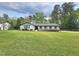 Classic single-story home with a spacious front yard and mature trees, perfect for suburban living at 5920 Holly Dr, Raleigh, NC 27616