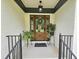 Inviting front porch with wooden door, potted plants, and a 'hello welcome' mat, offering a warm greeting at 5920 Holly Dr, Raleigh, NC 27616