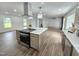 Spacious kitchen features a large island with cooktop, modern hood, and open layout at 5920 Holly Dr, Raleigh, NC 27616