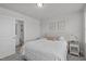 Comfortable bedroom with ensuite bath featuring neutral decor and bright natural light at 6309 Truxton Ln, Raleigh, NC 27616