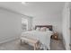 Cozy bedroom features natural light, neutral color palette, and comfortable furnishings at 6309 Truxton Ln, Raleigh, NC 27616