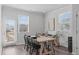 Inviting dining room with wood floors, natural light, modern table and chairs, and contemporary decor at 6309 Truxton Ln, Raleigh, NC 27616