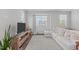 Cozy living room featuring a plush sectional sofa, a neutral rug, and bright natural light at 6309 Truxton Ln, Raleigh, NC 27616