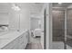 Spacious main bathroom featuring tile shower, double sinks and connecting bedroom at 6309 Truxton Ln, Raleigh, NC 27616
