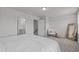 Bright main bedroom featuring a sitting area, ensuite bathroom, and neutral decor at 6309 Truxton Ln, Raleigh, NC 27616