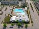 Aerial view of a neighborhood pool featuring a spacious pool, clubhouse, and playground area at 6309 Truxton Ln, Raleigh, NC 27616