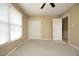 This bedroom boasts neutral walls, carpet, a closet, and a window for natural light at 6417 Meadow View Dr, Raleigh, NC 27609