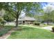 Exterior view of the community clubhouse with a well-maintained lawn at 6417 Meadow View Dr, Raleigh, NC 27609