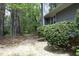 The home's exterior features mature trees and an inviting pathway at 6417 Meadow View Dr, Raleigh, NC 27609