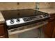 The kitchen features stainless steel oven and glass stovetop with granite countertops at 6417 Meadow View Dr, Raleigh, NC 27609