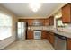 Kitchen with stainless steel appliances, tile backsplash and granite countertops at 6417 Meadow View Dr, Raleigh, NC 27609