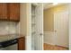 Kitchen pantry with pull out drawers, storage cabinets and stainless steel dishwasher at 6417 Meadow View Dr, Raleigh, NC 27609