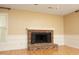 Living room showcases a brick fireplace with white mantel and hardwood floors at 6417 Meadow View Dr, Raleigh, NC 27609