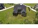 Aerial view of a home showing backyard with a screened-in porch and well-maintained lawn at 6521 Camellia Creek Dr, Raleigh, NC 27603