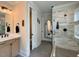 Bathroom featuring hexagon tile flooring, modern vanity, toilet and marble tile shower with black fixtures at 6521 Camellia Creek Dr, Raleigh, NC 27603