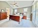 Serene bedroom featuring a cozy bed, side tables, and soft lighting for a relaxing atmosphere at 6521 Camellia Creek Dr, Raleigh, NC 27603