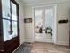 Front door view into home office featuring french doors and decorative wainscoting at 6521 Camellia Creek Dr, Raleigh, NC 27603
