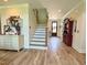 Inviting foyer features a staircase, wood floors and patriotic decor elements at 6521 Camellia Creek Dr, Raleigh, NC 27603