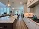 Bright, open kitchen with a spacious island, modern appliances, and white cabinets for a clean, contemporary feel at 6521 Camellia Creek Dr, Raleigh, NC 27603