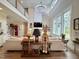 Spacious living room with cathedral ceiling, modern fireplace, and an abundance of natural light at 6521 Camellia Creek Dr, Raleigh, NC 27603