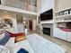 Open living room showcasing fireplace, vaulted ceiling and seamless transition into dining area at 6521 Camellia Creek Dr, Raleigh, NC 27603
