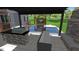 Entertaining is easy with this outdoor kitchen, stone fireplace, and a view of the beautiful pool at 6521 Camellia Creek Dr, Raleigh, NC 27603