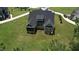 Aerial view of home's rear featuring a screened porch, and expansive lawn at 6521 Camellia Creek Dr, Raleigh, NC 27603