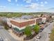 A vibrant commercial building with a brick facade and nearby parking, nestled in a lively area at 700 Market St # 214, Chapel Hill, NC 27516