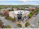 Aerial view of a commercial building featuring a modern facade and ample parking at 700 Market St # 214, Chapel Hill, NC 27516