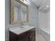 Bathroom vanity with a white sink and shower at 700 Market St # 214, Chapel Hill, NC 27516