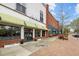 Charming storefront with awnings and large windows, showcasing the entrance to Rishi Salon at 700 Market St # 214, Chapel Hill, NC 27516
