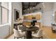 Bright kitchen with stainless appliances, wood cabinets and dining table for an eat-in space at 700 Market St # 214, Chapel Hill, NC 27516