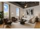 Open living space featuring hardwood floors, exposed ductwork, natural light, and modern furnishings at 700 Market St # 214, Chapel Hill, NC 27516