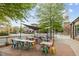 Outdoor seating area with colorful chairs and tables, offering a vibrant space for dining and socializing at 700 Market St # 214, Chapel Hill, NC 27516