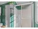 Bathroom featuring a white shower with sliding door and green wall paper at 706 Forest Dr, Garner, NC 27529