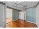 Bright bedroom with original hardwood floors and quaint wallpaper at 706 Forest Dr, Garner, NC 27529