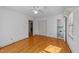 This bedroom features hardwood floors, an overhead light and a closet at 706 Forest Dr, Garner, NC 27529