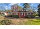 Charming brick home featuring a well-maintained lawn, manicured shrubbery, and a classic design at 706 Forest Dr, Garner, NC 27529