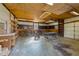 Spacious garage and workspace with ample shelving and visible workbench for DIY projects and storage at 706 Forest Dr, Garner, NC 27529