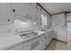Clean white kitchen with modern stove, sink, and lots of cabinet space at 706 Forest Dr, Garner, NC 27529