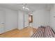 Living room with hardwood floors, white paneling and a sofa at 706 Forest Dr, Garner, NC 27529